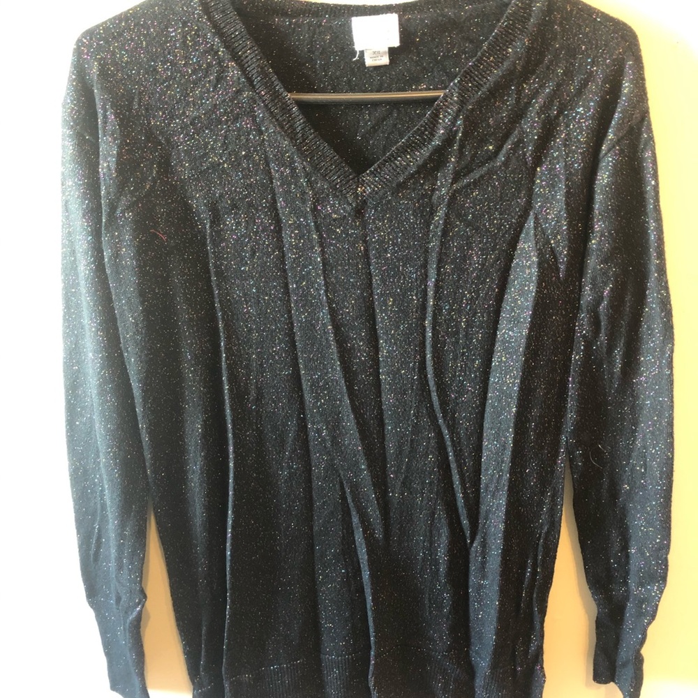 Black sweater with colorful sparkles.